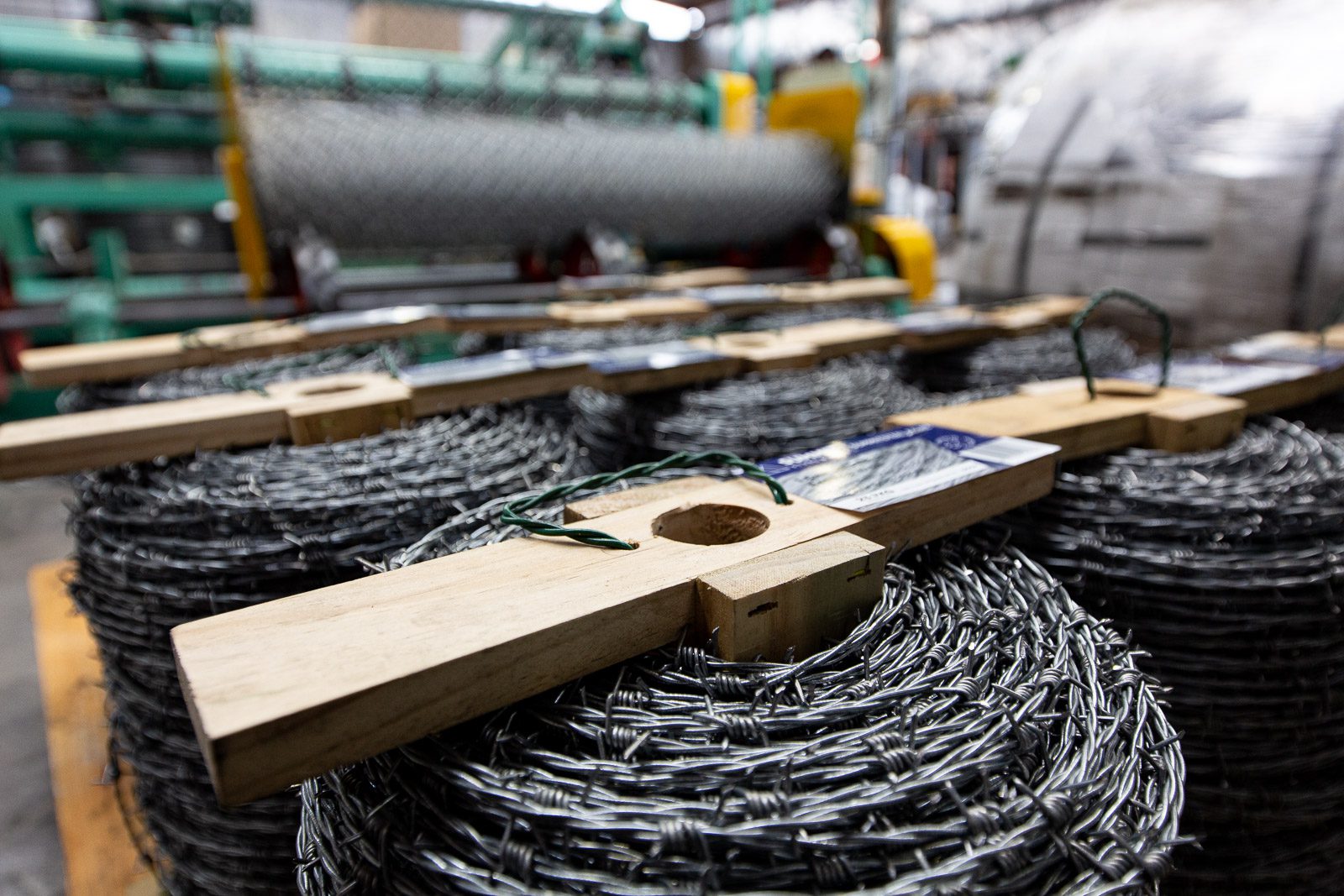 Razor wire and barbed wire coils ready for installation as an electric security fence deterrent